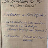 Flipchart mit Notizen, unter anderem 'Die Einrichtung ist Teil des Gemeinwesens'